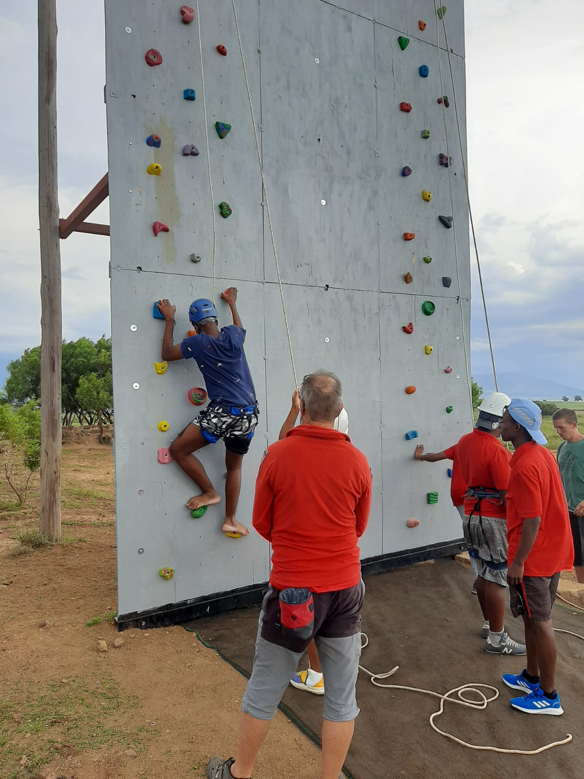 Learners climbing the climbing wall